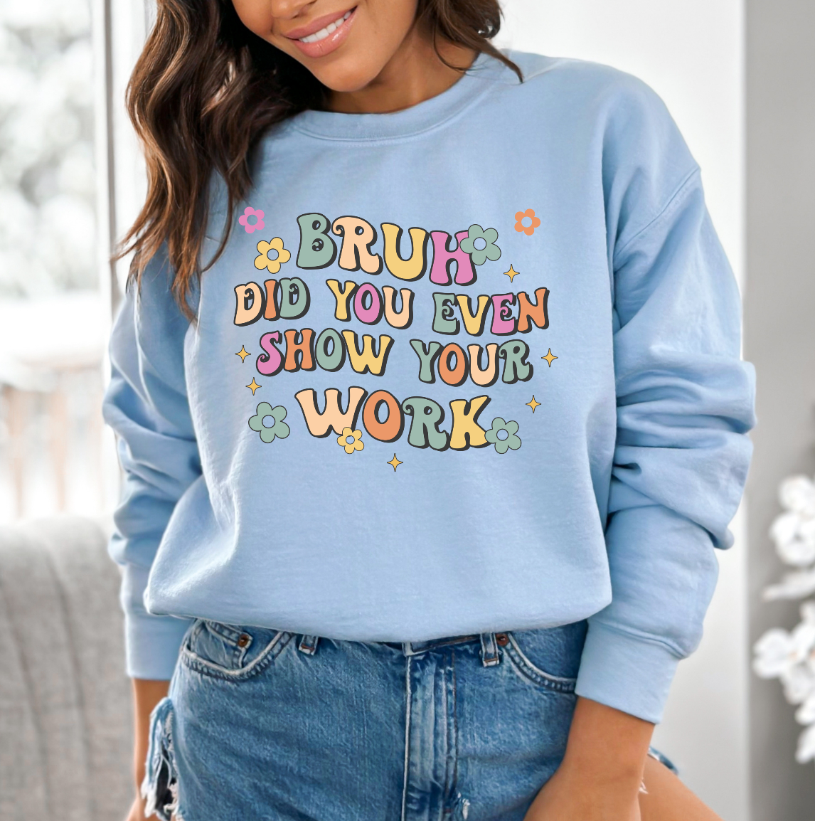 a woman wearing a blue sweatshirt that says bruh did you even show your work