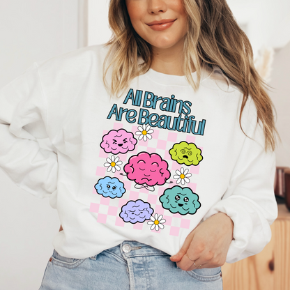A woman wearing a white sweatshirt with a colorful graphic design featuring cartoon-style clouds and flowers.