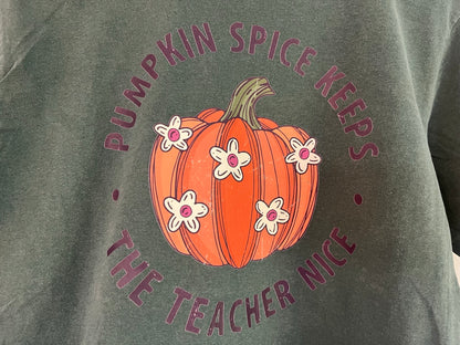 a person wearing a t - shirt with a pumpkin on it